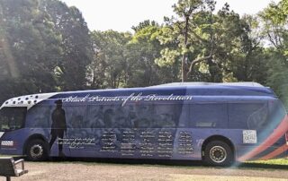 The Greensboro bus with the Black patriots wrap on display at Guilford Courthouse National Military Park. Photo by Bernetiae Reed.